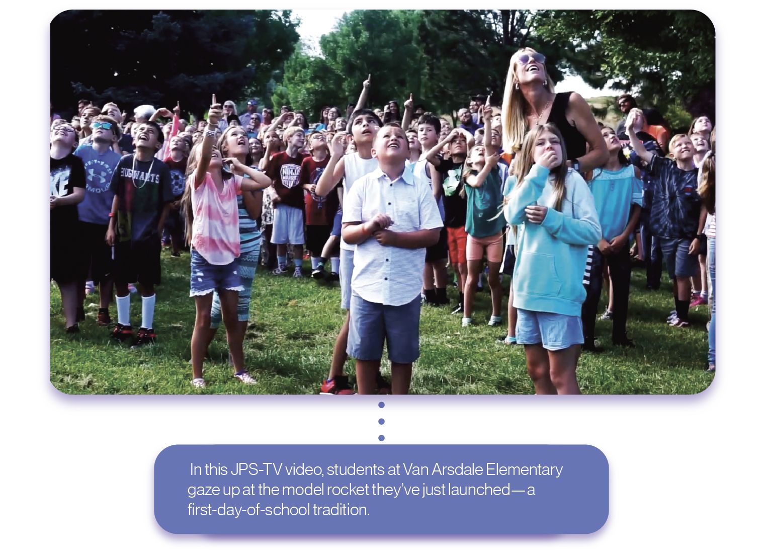 In the video, students gaze up at the rocket they just launched, a first-day-of-school tradition.