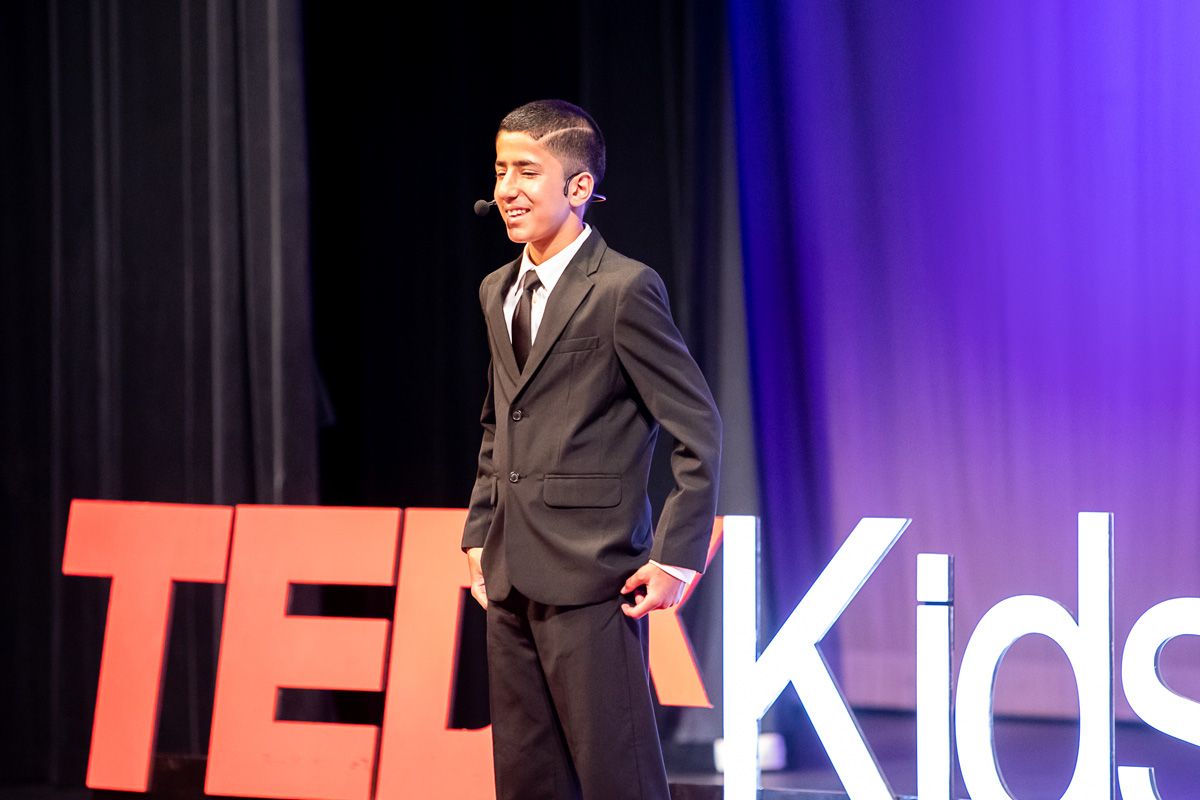 A young student from Cajon Valley giving a speech on stage