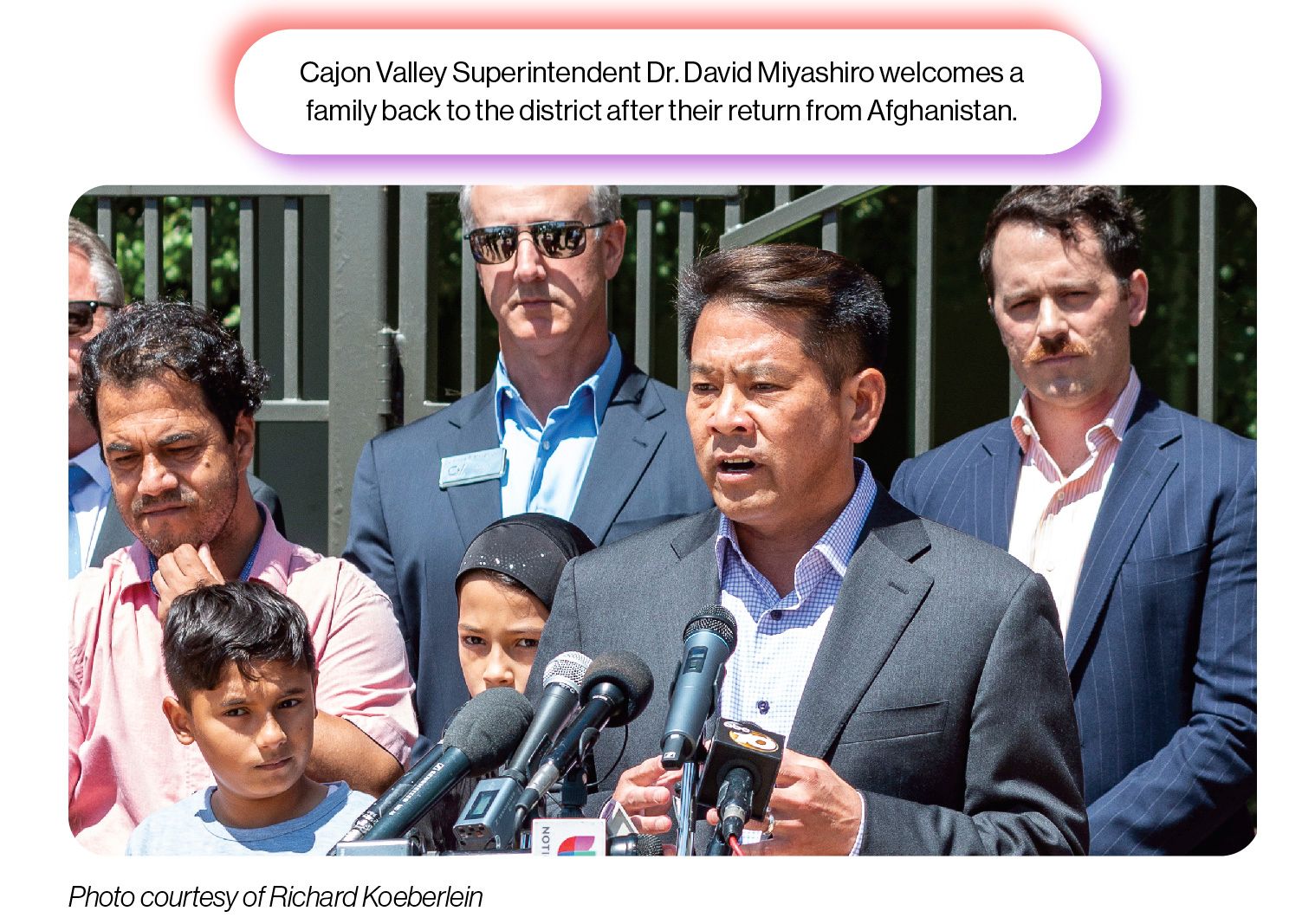 Image: A photo from a Cajon Valley Union School District press conference, with the SchoolCEO caption 'Cajon Valley Superintendent Dr. David Miyashiro welcomes a family back to the district after their return from Afghanistan.'