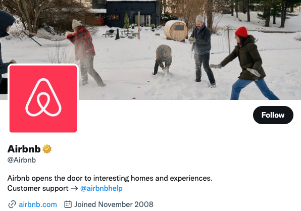 Airbnb's Twitter profile, with a bio "Airbnb opens the door to interesting homes and experiences."