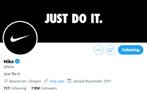 Nike's Twitter profile, with both the cover photo and bio using their slogan "Just Do It."