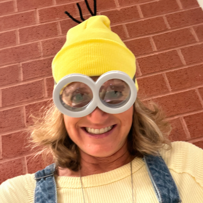 Photograph of Dr. Laura Blessing dressed as a cartoon minion for Halloween 