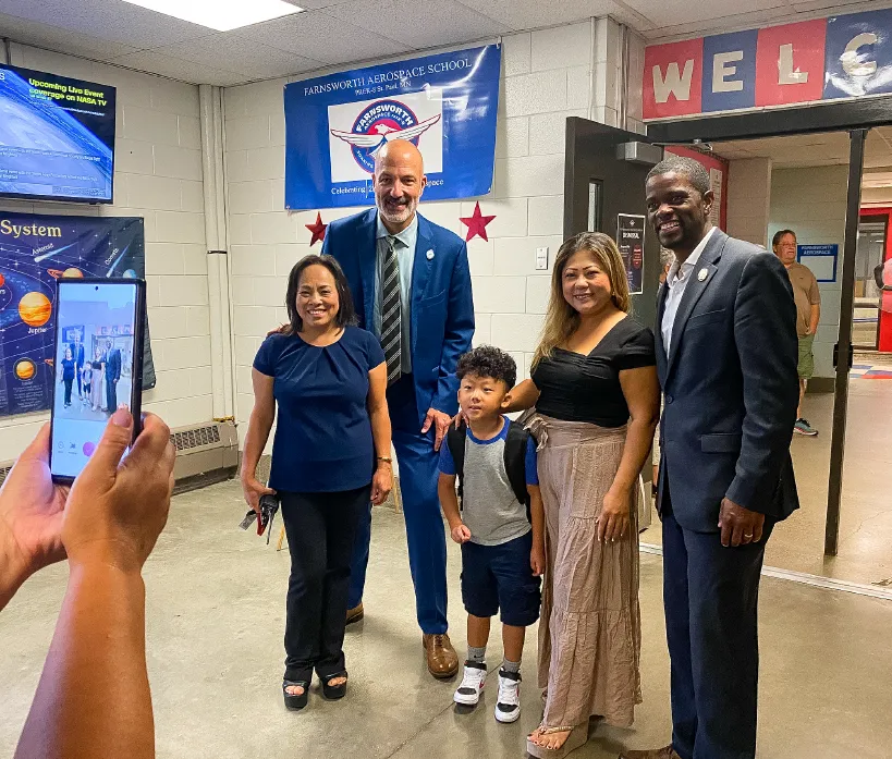 Photograph of Dr. Joe Gothard with student, parent, and staff members