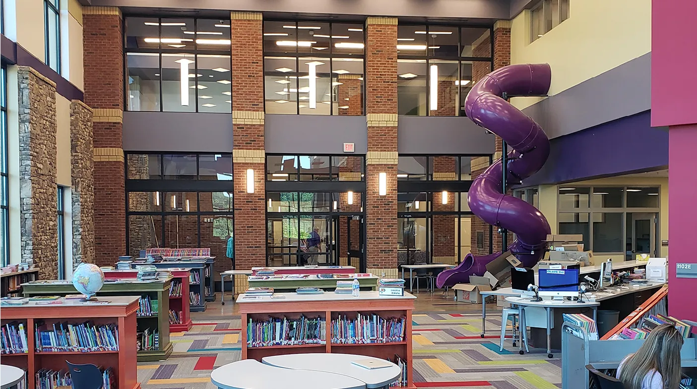 Photograph of Cottrell Elementary library with purple slide